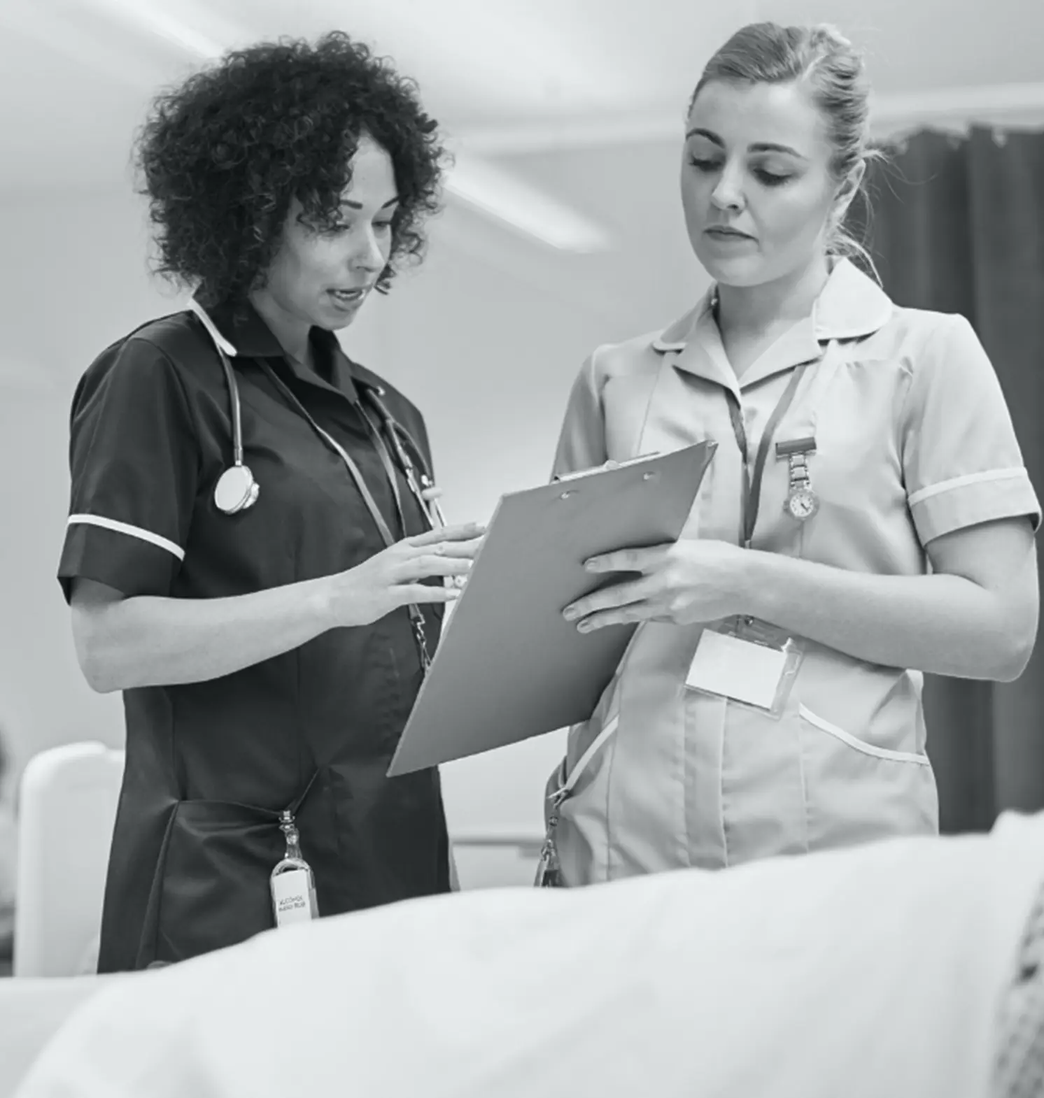 doctor and nurse going over patients charts