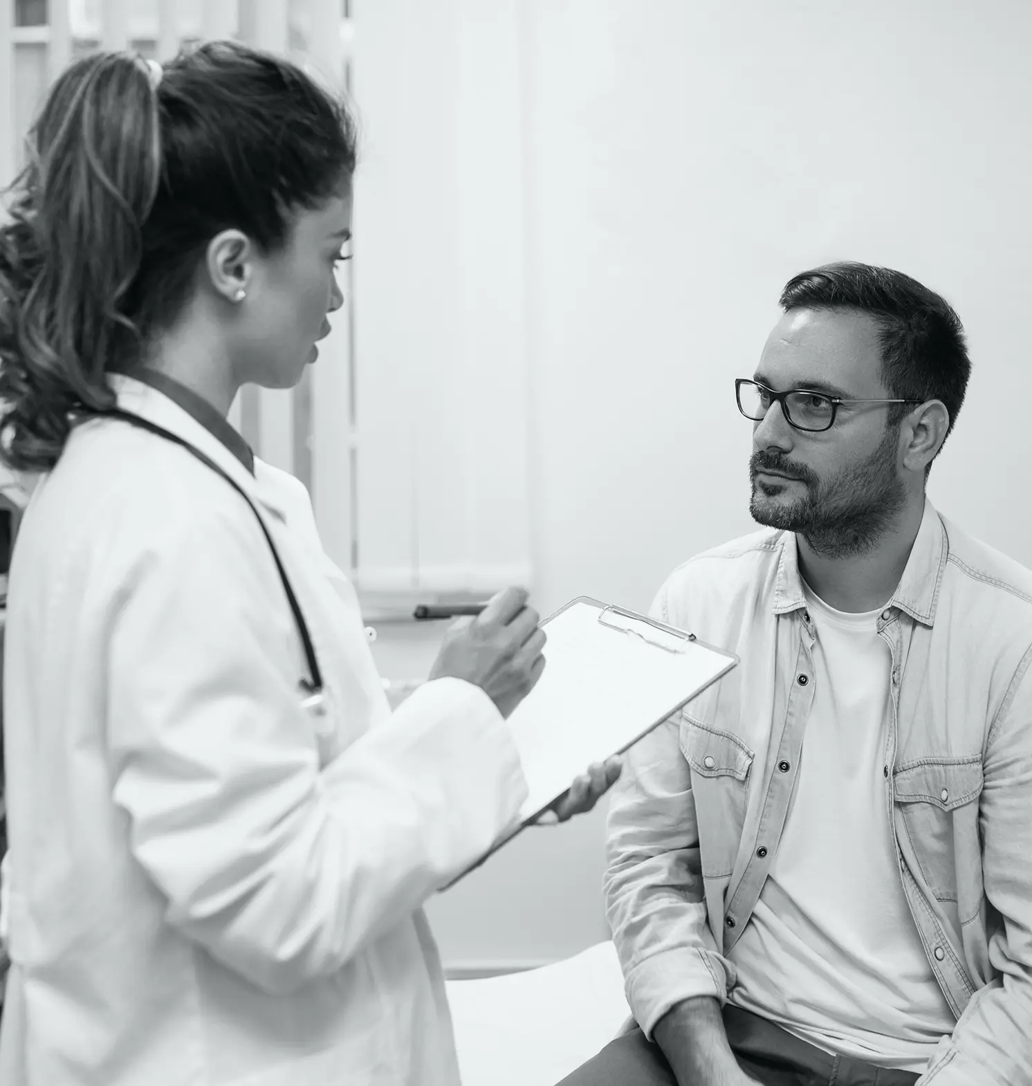 doctor filling out patient chart