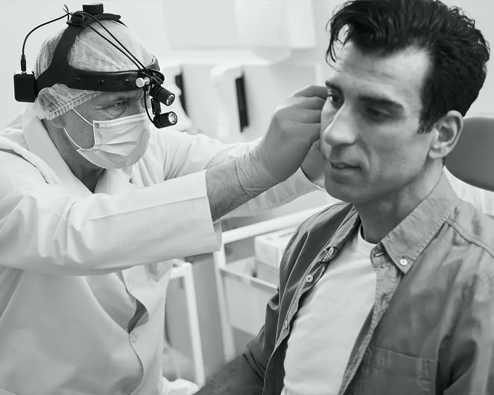 Close up otorhinolaryngologist and patient