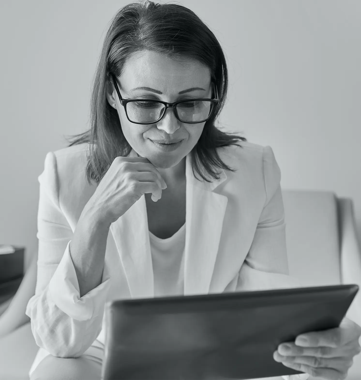 a professional woman holding a tablet