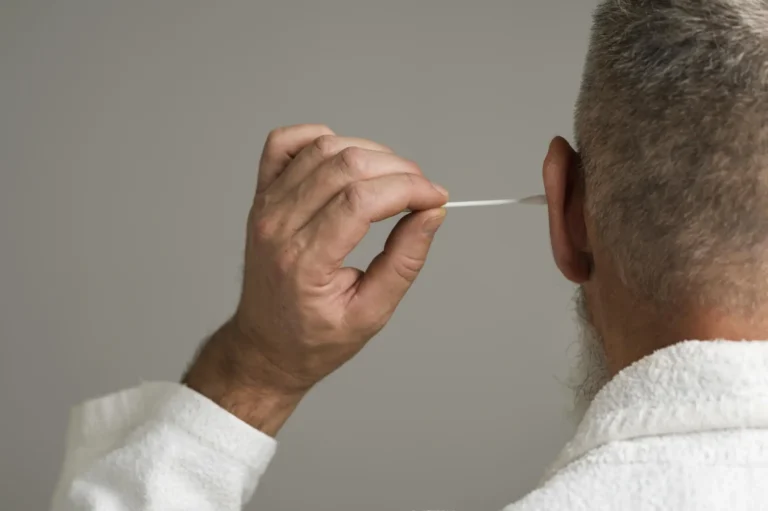 close-up-man-using-cotton-swab