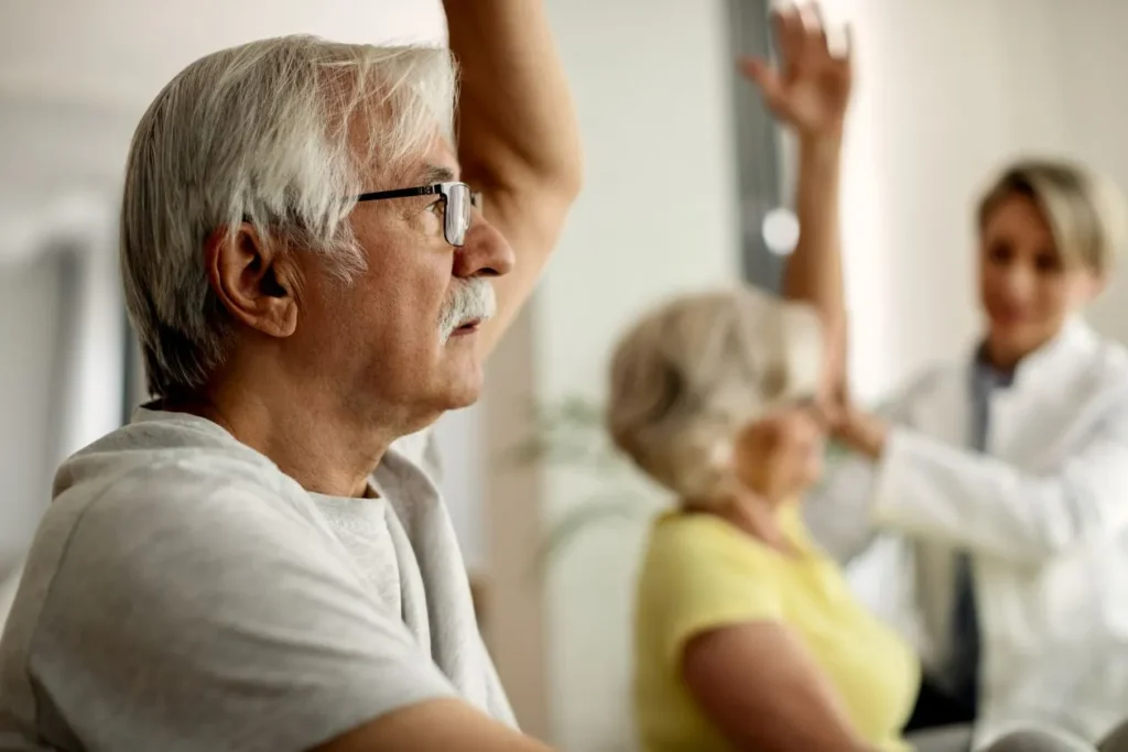 senior man having exercise class home