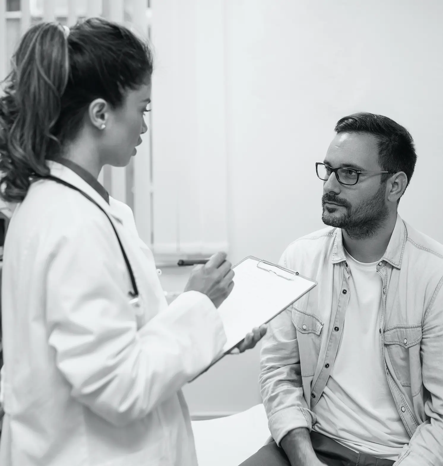 A doctor filling out patient chart