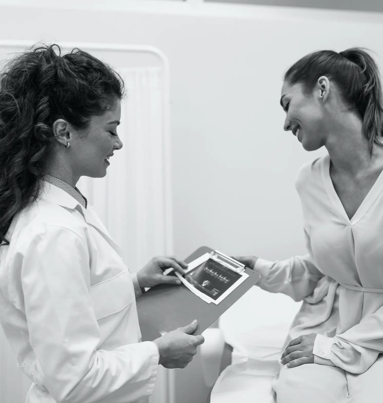 gynecology specialist showing patient ultrasound results