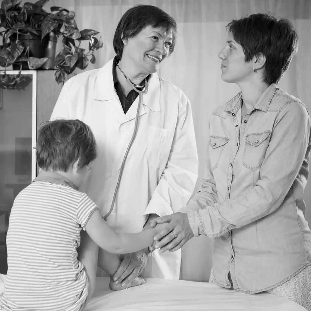 Pediatrician talking with patient parent