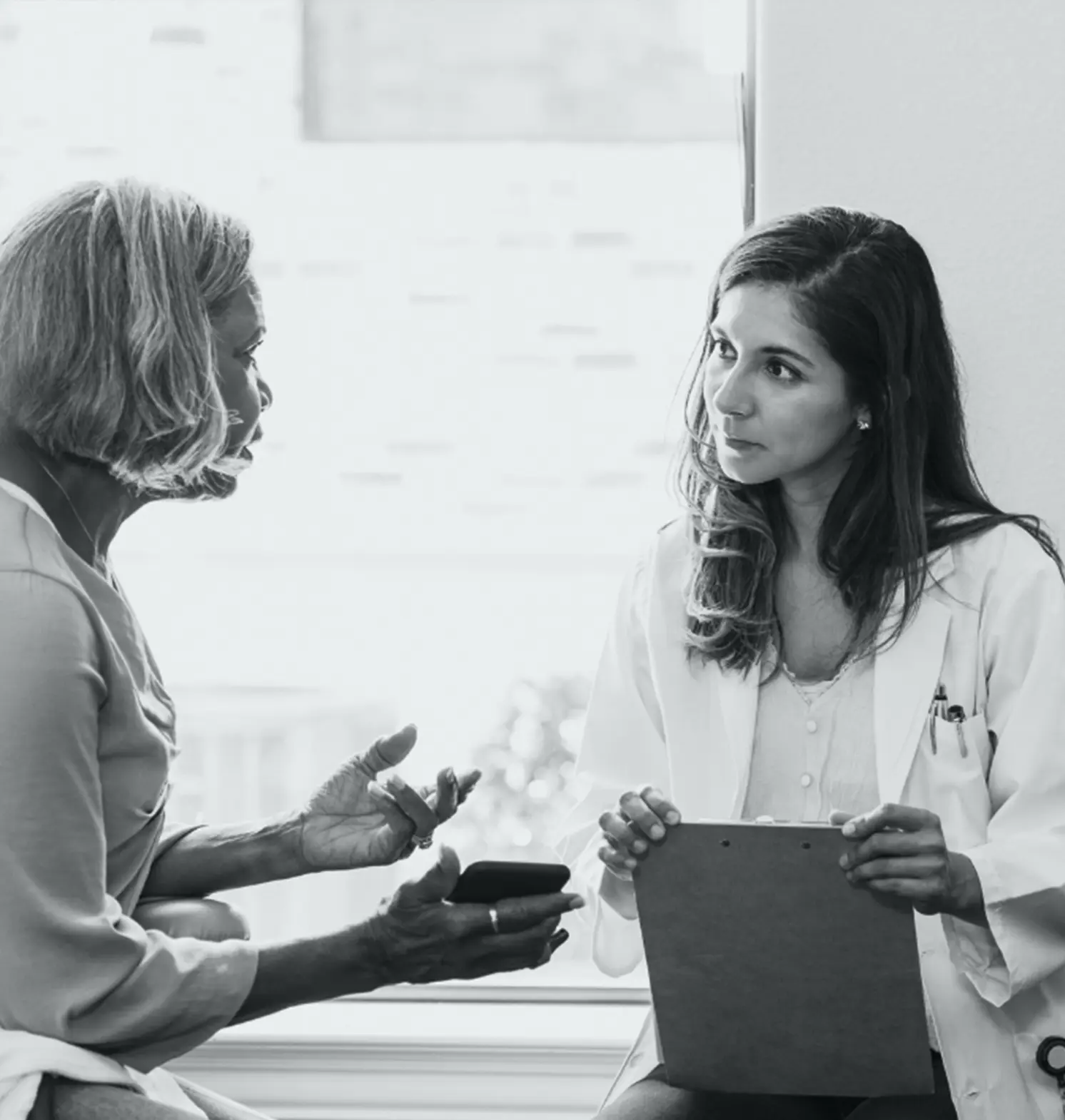 patient talking to her doctor