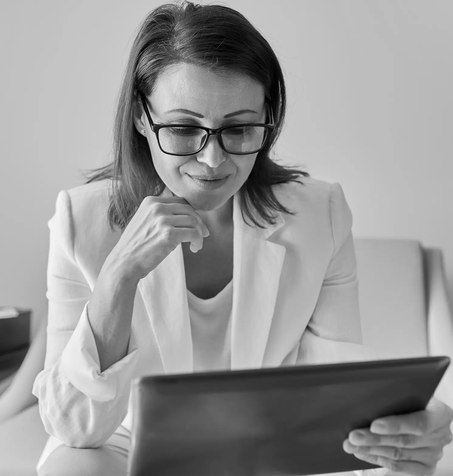 a professional woman holding a tablet