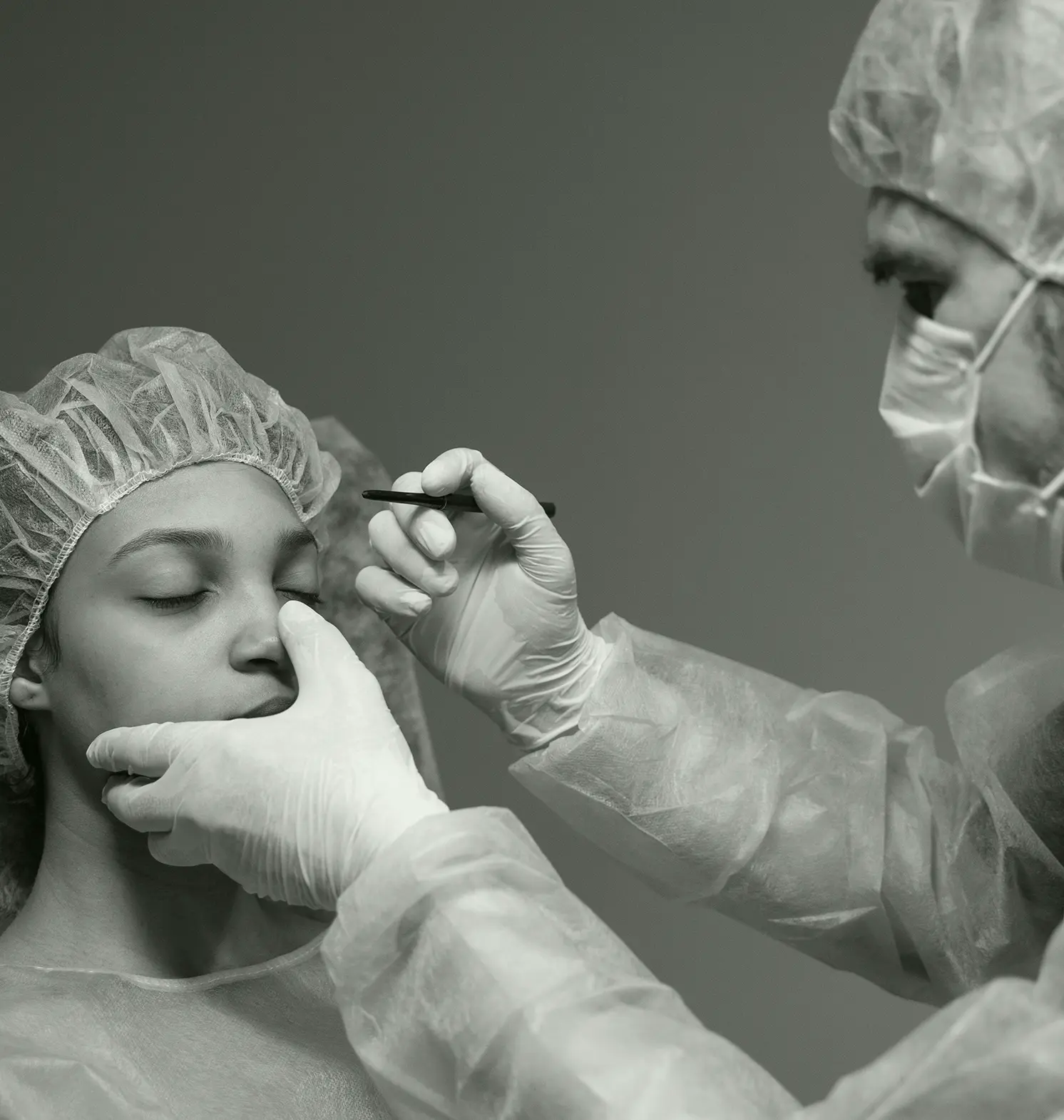 Surgeon Checking Patient Before Rhinoplasty